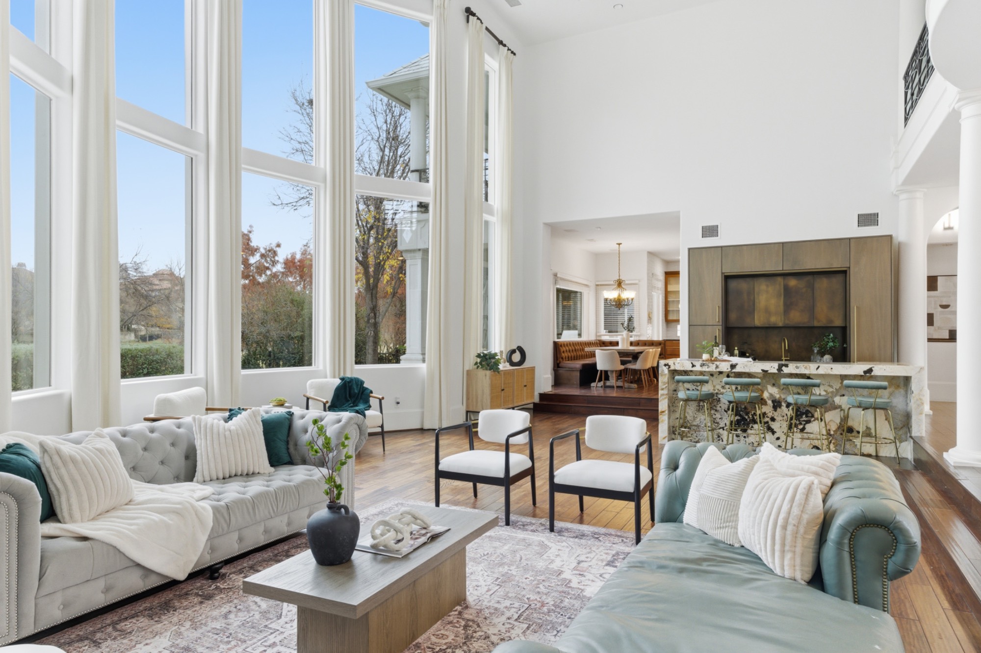 Two-story living room with floor-to-ceiling windows