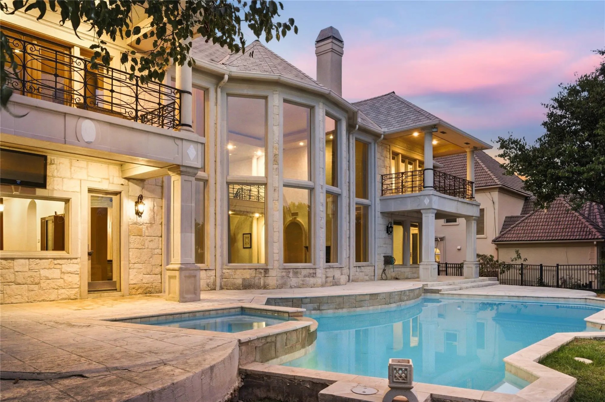 Resort-style pool and patio at twilight